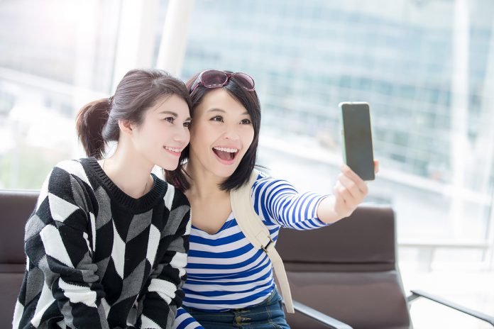 woman take smart phone selfie