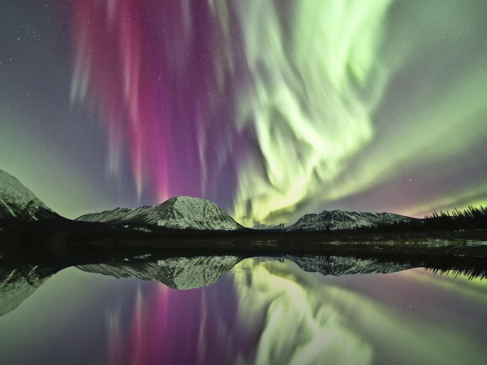 Reflection of northern lights on lake