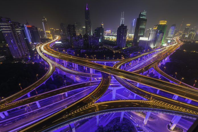 Shanghai neon night highway futuristic illuminated skyscrapers China